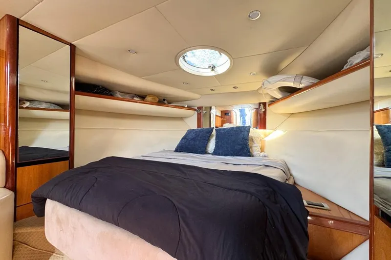 Slide: The Image of Luxurious cabin interior of 2004 Sunseeker Sportfisher 37 yacht with cozy bedding. - 93
