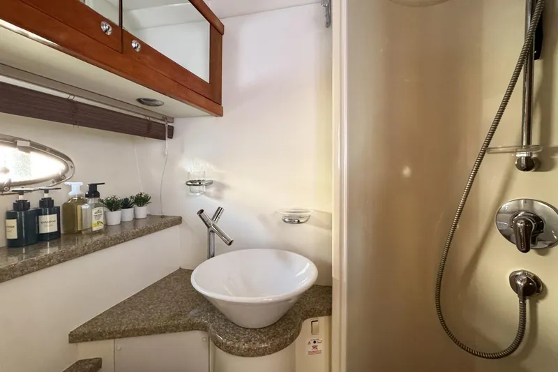 Slide: The Image of Luxurious bathroom in 2004 Sunseeker Sportfisher 37 yacht with modern fixtures and elegant design. - 119