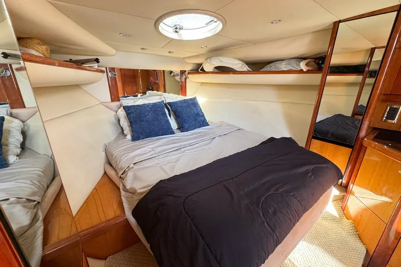 Slide: The Image of Luxurious cabin interior of 2004 Sunseeker Sportfisher 37 yacht with cozy bedding. - 97
