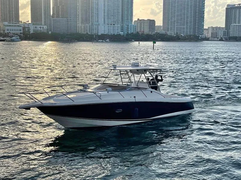 The Image of 2004 Sunseeker Sportfisher 37 boat on water with city skyline background. - 0