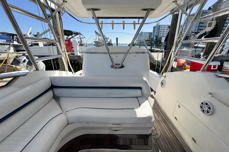 Slide: The Image of 2004 Sunseeker Sportfisher 37 interior with white seating and polished metal accents. - 44