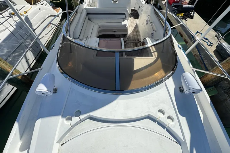 Slide: The Image of 2004 Sunseeker Sportfisher 37 boat deck with seating and railing, docked at marina. - 60