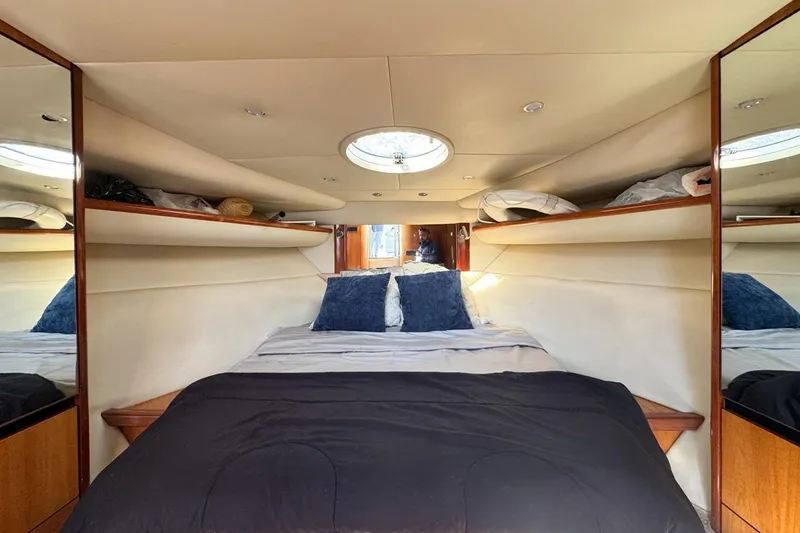 Slide: The Image of Luxurious cabin interior of 2004 Sunseeker Sportfisher 37 yacht with cozy bedding. - 92