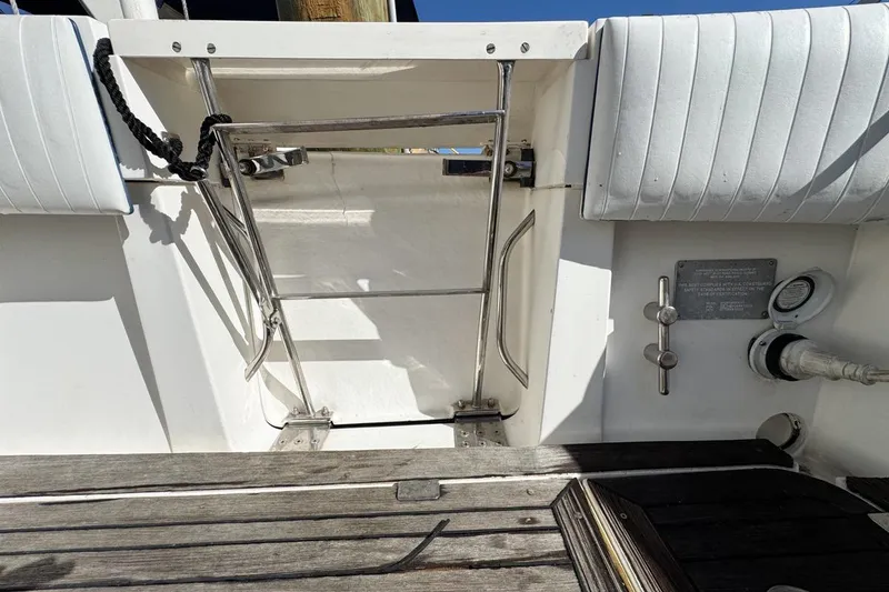 Slide: The Image of 2004 Sunseeker Sportfisher 37 boat interior with stainless steel fittings and wooden deck. - 74