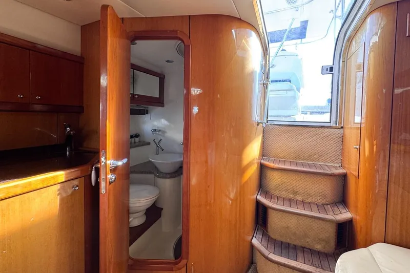 Slide: The Image of Interior of 2004 Sunseeker Sportfisher 37 yacht with wooden cabinetry and stairs. - 118