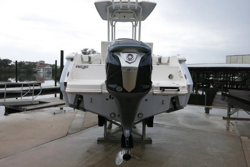 Slide: The Image of 2022 Robalo R230 Center Console boat with Yamaha outboard motor at dockside. - 3