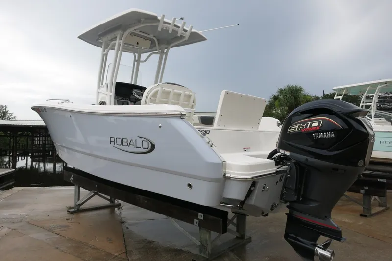 Slide: The Image of 2022 Robalo R230 Center Console boat with Yamaha engine, docked outdoors. - 6