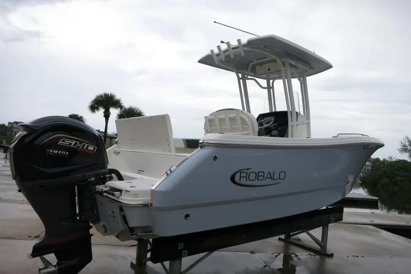 Slide: The Image of 2022 Robalo R230 Center Console boat with Yamaha engine on display. - 2