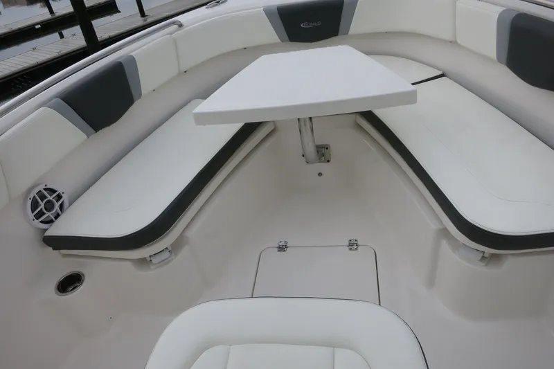Slide: The Image of 2022 Robalo R230 Center Console boat interior with seating and table. - 23