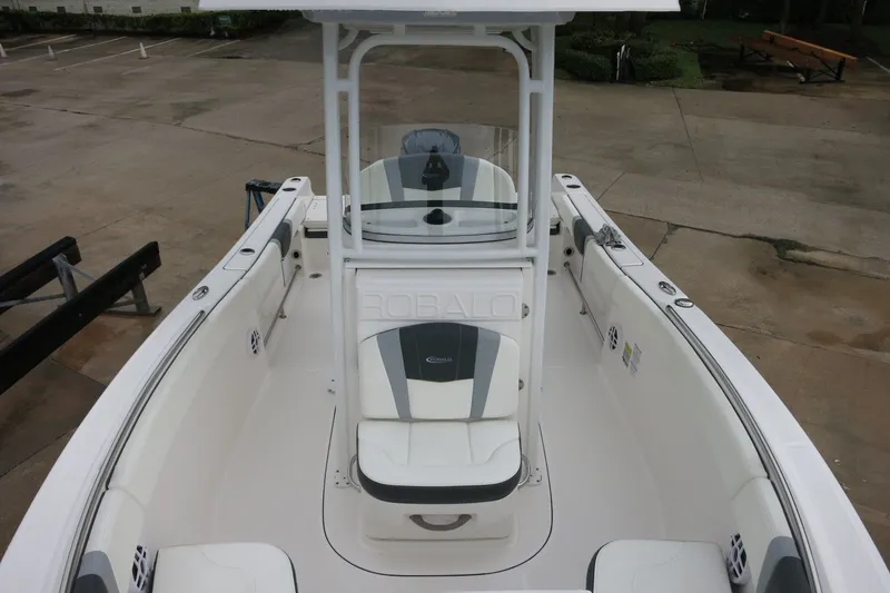 Slide: The Image of 2022 Robalo R230 Center Console boat with spacious seating and sleek design. - 17