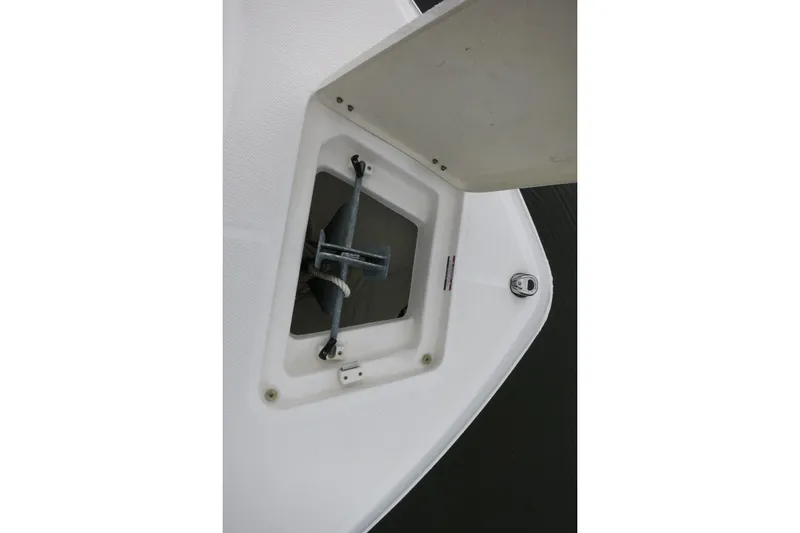 Slide: The Image of Anchor compartment of 2022 Robalo R230 Center Console boat, featuring secure storage. - 15