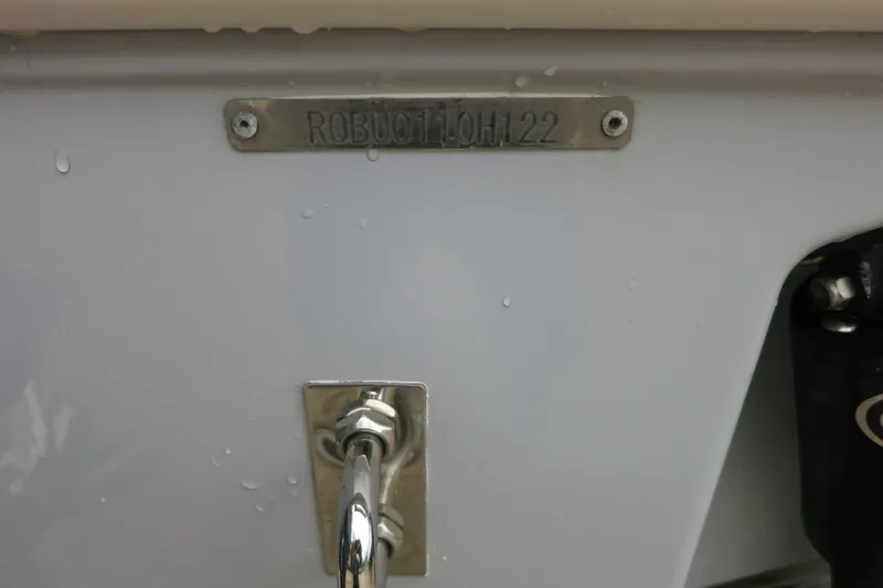 Slide: The Image of 2022 Robalo R230 Center Console boat identification plate with serial number. - 24