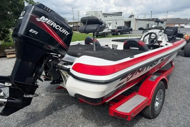 Slide: The Image of 2008 Nitro Z-7 boat with Mercury EFI engine on a red trailer. - 3