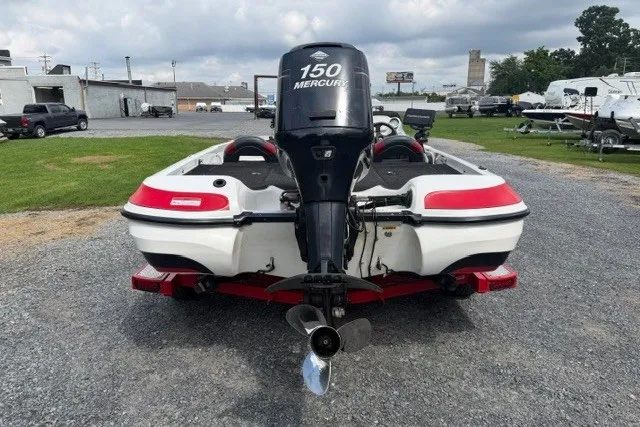 Slide: The Image of 2008 Nitro Z-7 boat with 150 Mercury engine, parked on gravel lot. - 4
