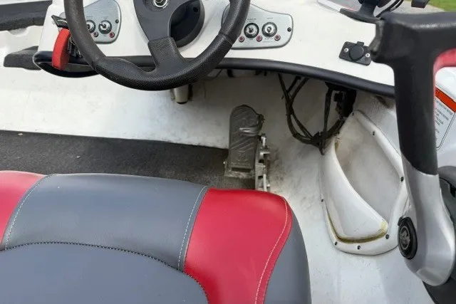 Slide: The Image of 2008 Nitro Z-7 boat cockpit with steering wheel and red-gray seat. - 8