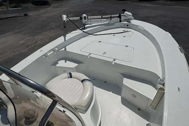 Slide: The Image of 2005 Polar 2100 Center Console boat with seating and fishing rod holders. - 13
