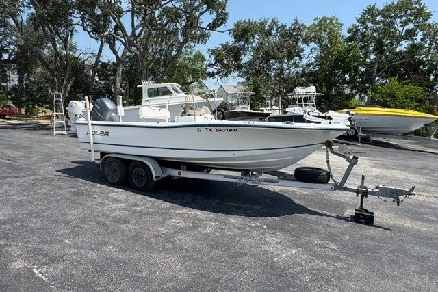 The Image of 2005 Polar 2100 Center Console boat on trailer in parking lot. - 0