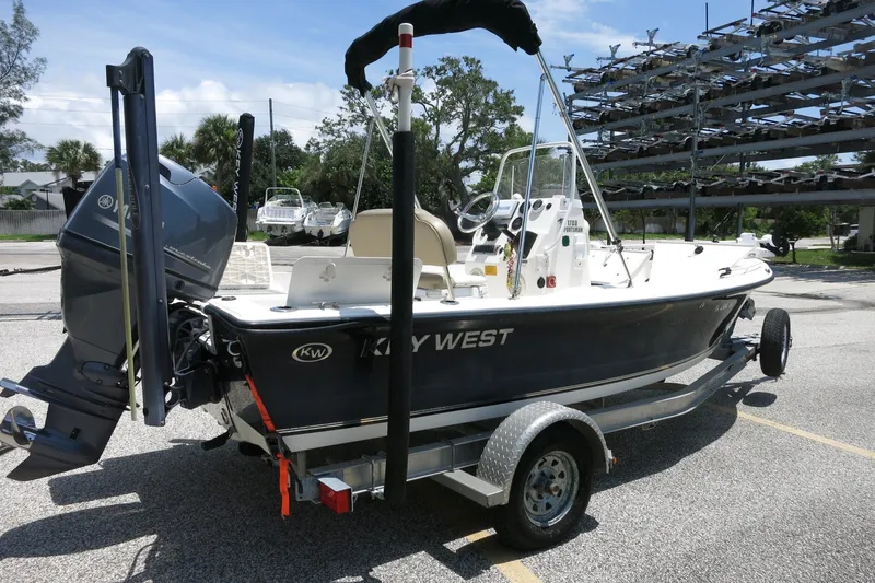 Slide: The Image of 2016 Key West 1720 Center Console boat on trailer in parking lot. - 8