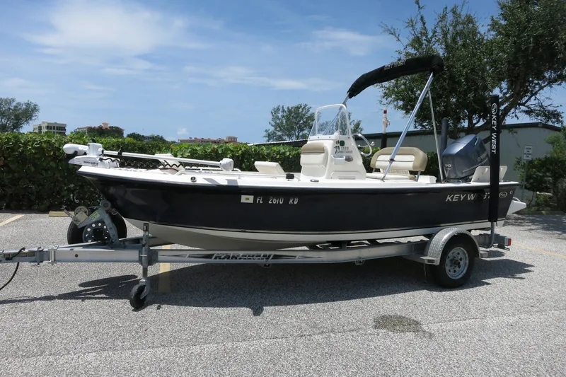 Slide: The Image of A 2016 Key West 1720 Center Console boat on a trailer, parked in a lot. - 36