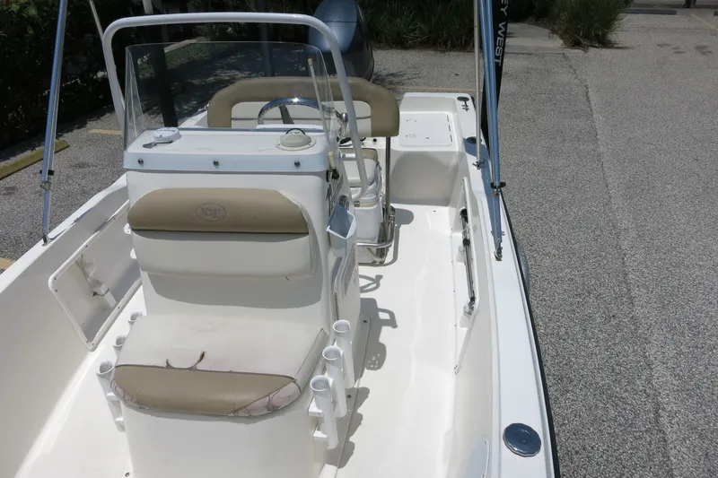 Slide: The Image of 2016 Key West 1720 Center Console boat interior with seating and steering wheel. - 32