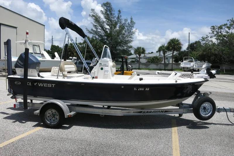 Slide: The Image of 2016 Key West 1720 Center Console boat on trailer in sunny parking lot. - 9