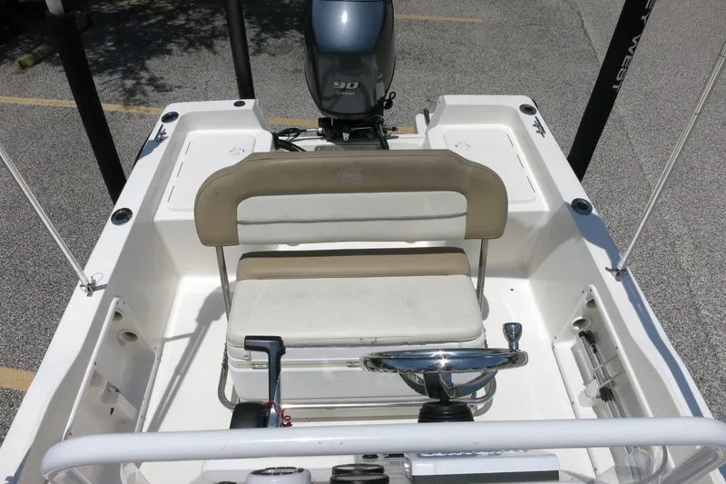 Slide: The Image of 2016 Key West 1720 Center Console boat interior with seating and steering wheel. - 34