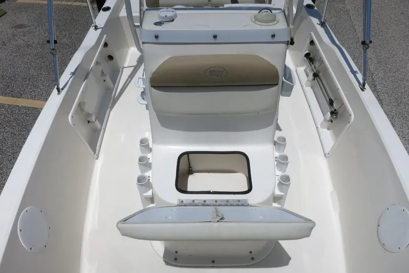 Slide: The Image of 2016 Key West 1720 Center Console boat interior with seating and storage compartments. - 30