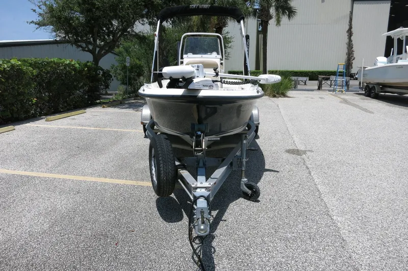 Slide: The Image of 2016 Key West 1720 Center Console boat on trailer in parking lot. - 12