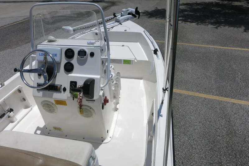 Slide: The Image of 2016 Key West 1720 Center Console boat interior with steering wheel and controls. - 24