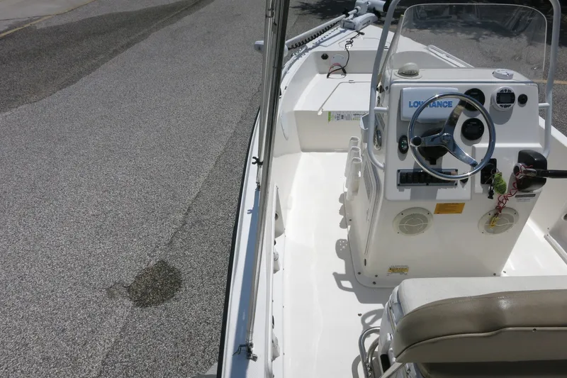 Slide: The Image of 2016 Key West 1720 Center Console boat interior with steering wheel and controls. - 23