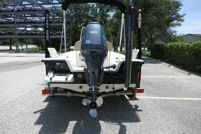 Slide: The Image of 2016 Key West 1720 Center Console boat with 90 HP engine in parking lot. - 5