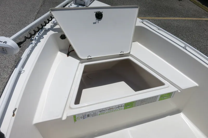 Slide: The Image of 2016 Key West 1720 Center Console boat with open storage compartment on deck. - 28