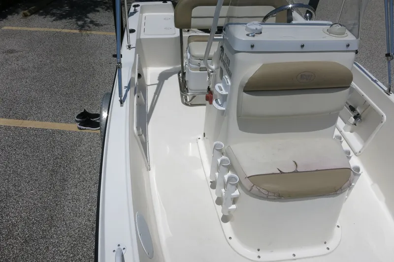 Slide: The Image of 2016 Key West 1720 Center Console boat interior with seating and console details. - 33