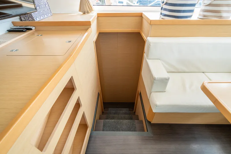Slide: The Image of Interior of a 2017 Lagoon 42 with light wood and white upholstery. - 41