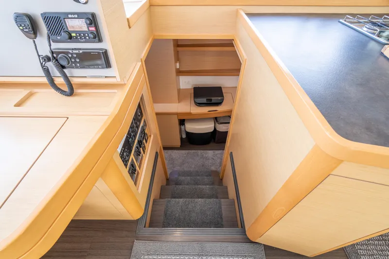 Slide: The Image of Interior view of a 2017 Lagoon 42 with stairs and navigation equipment. - 26