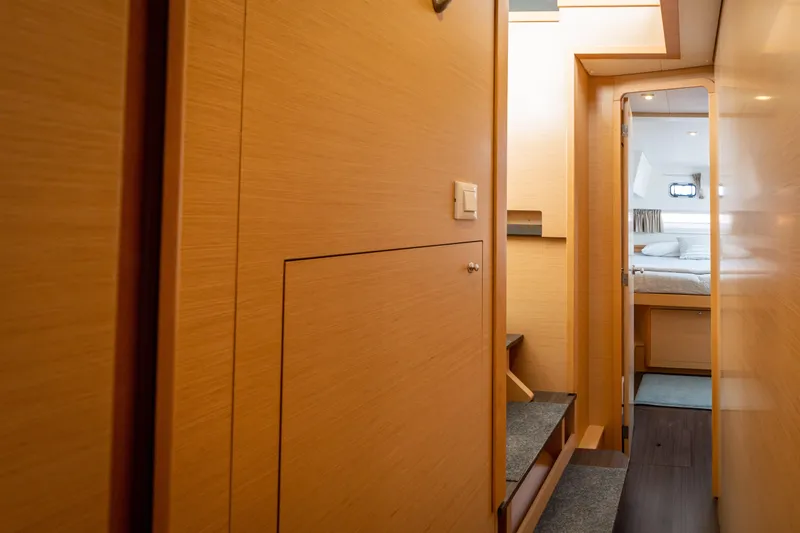 Slide: The Image of Interior of a 2017 Lagoon 42 with wooden walls and a bedroom. - 42