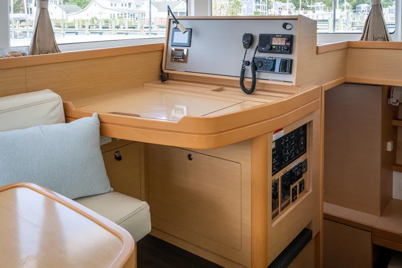 Slide: The Image of Interior view of a 2017 Lagoon 42 featuring a navigation area and communication equipment. - 23