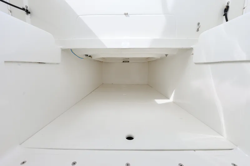 Slide: The Image of Spacious storage compartment in 2011 SeaVee 340B Open boat, featuring clean white interior. - 12