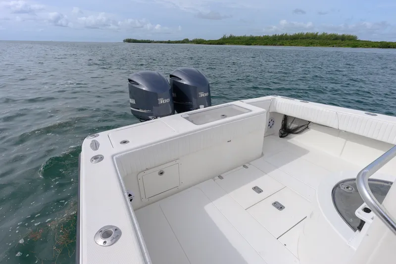 Slide: The Image of 2011 SeaVee 340B Open boat with dual Yamaha engines on calm water. - 18