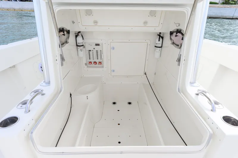 Slide: The Image of 2011 SeaVee 340B Open boat interior with control panel and safety equipment. - 11