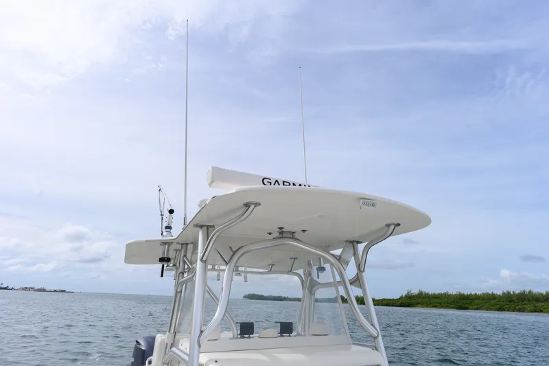Slide: The Image of 2011 SeaVee 340B Open boat with radar, cruising on calm waters. - 17