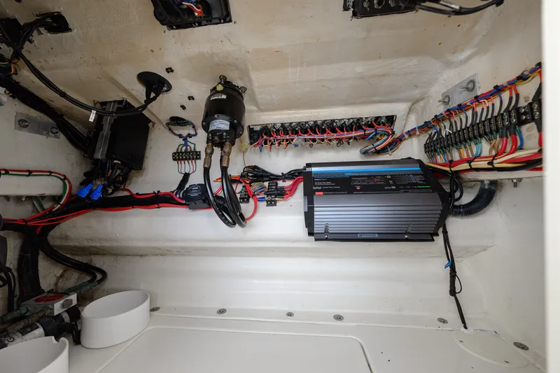 Slide: The Image of Electrical system inside a 2011 SeaVee 340B Open boat, showcasing wiring and components. - 13