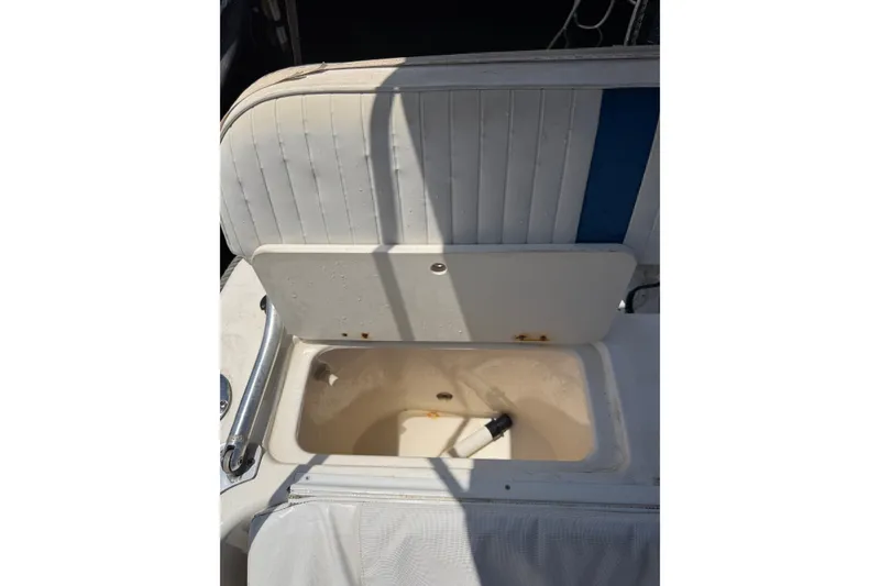 Slide: The Image of Open storage compartment on a 2002 Sea Fox 230 Walk Around boat. - 34