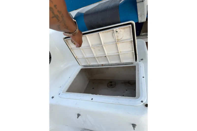 Slide: The Image of Open storage compartment on a 2002 Sea Fox 230 Walk Around boat. - 36
