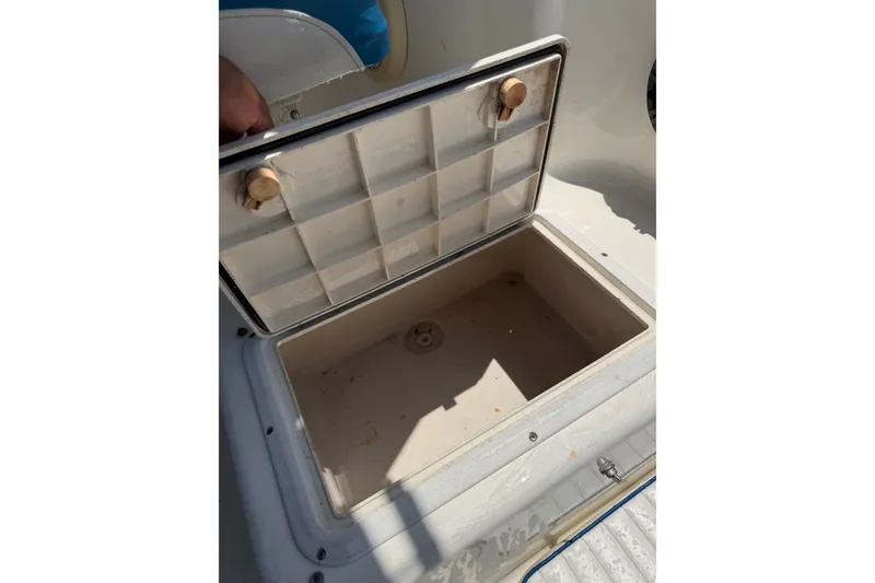 Slide: The Image of Open storage compartment on 2002 Sea Fox 230 Walk Around boat. - 38