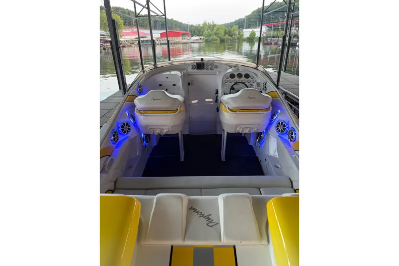 Slide: The Image of Interior of a 2002 Donzi 38 Daytona boat with illuminated dashboard and seating. - 21