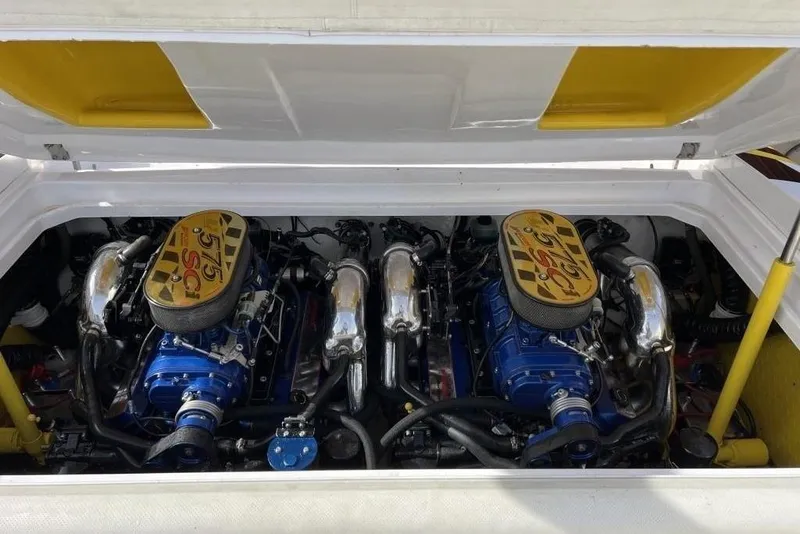 Slide: The Image of 2002 Donzi 38 Daytona engine compartment with dual high-performance engines. - 11