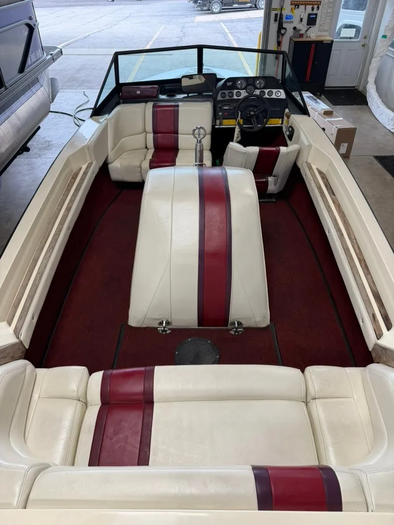 Slide: The Image of Interior view of a 1987 Correct Craft Ski Nautique 2001 with cream and red seating. - 22