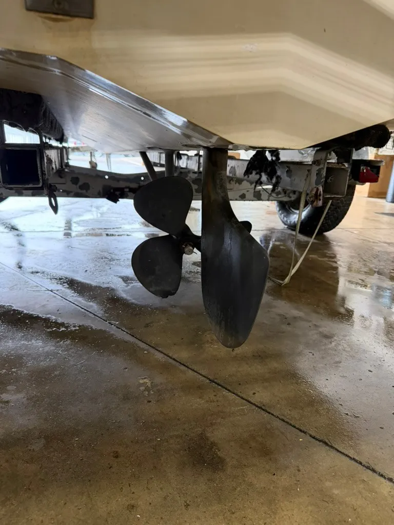 Slide: The Image of A 1987 Correct Craft Ski Nautique 2001 with visible propeller and rudder on a trailer. - 17
