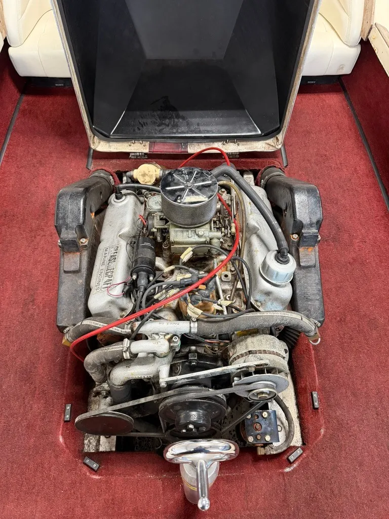 Slide: The Image of An open engine compartment of a 1987 Correct Craft Ski Nautique 2001 with a clearly visible engine. - 14
